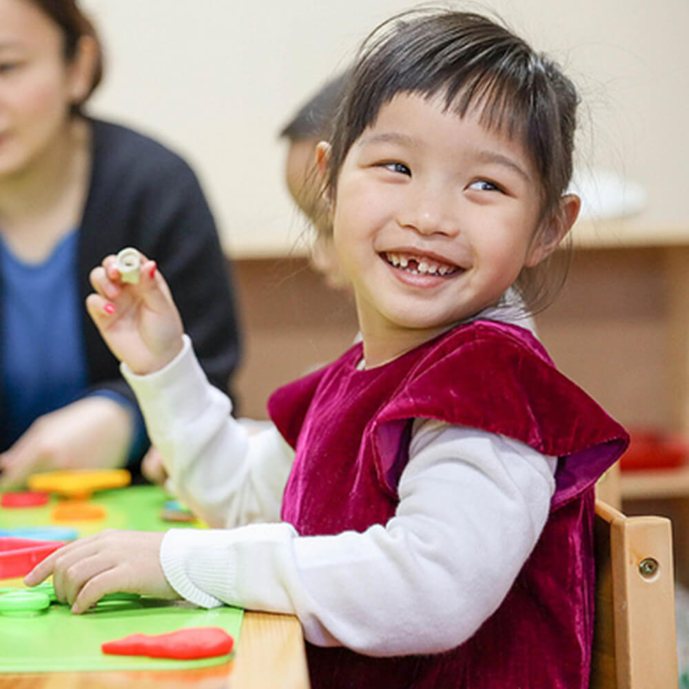 young girl enjoying pre-school
