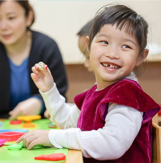 young girl enjoying pre-school