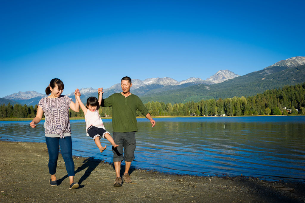 a young family at the lake