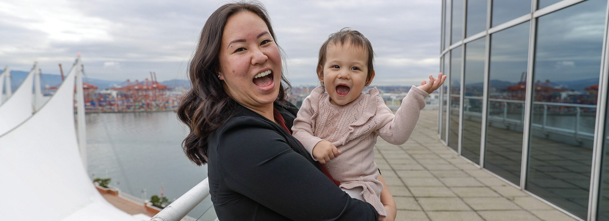 smiling mother and baby in a urban environment