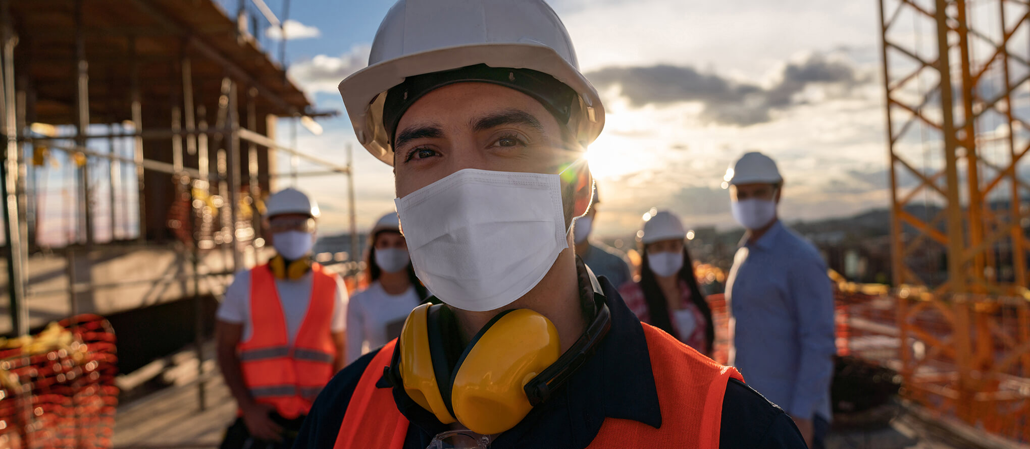 construction worker smiling at job site
