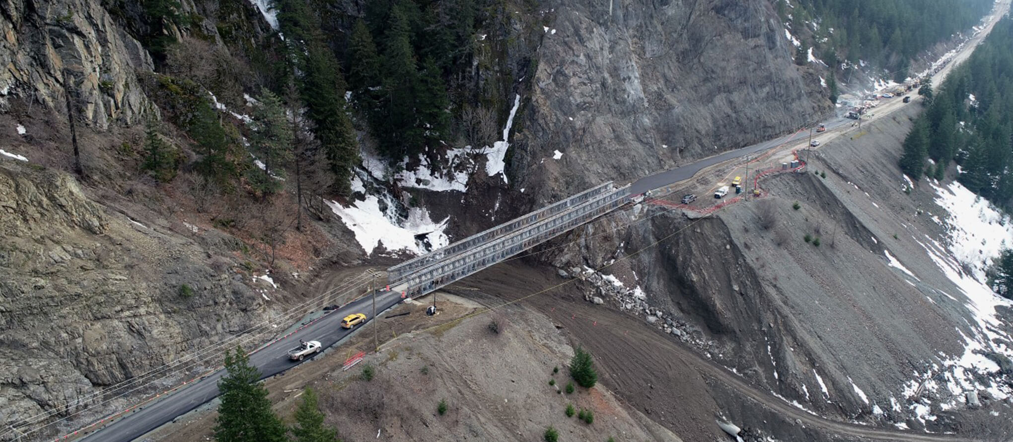 constructing a bridge over a washed out section of road