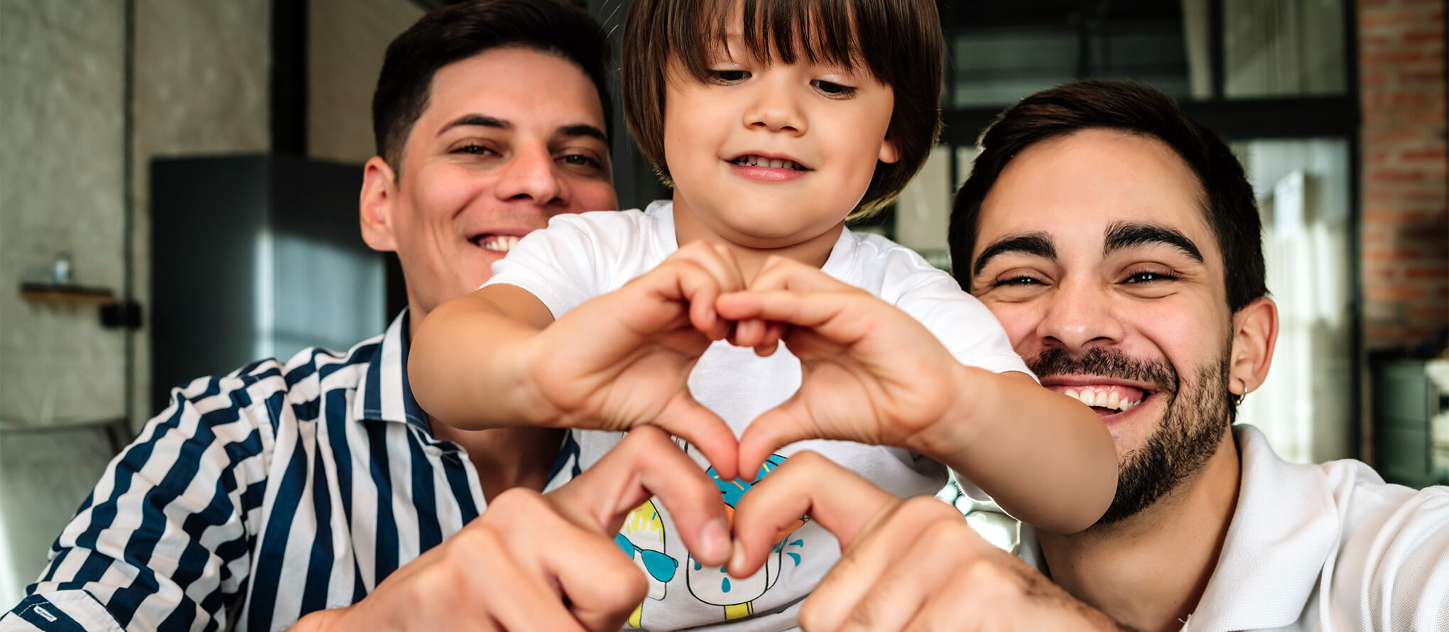 a happy family making hearts with their hands