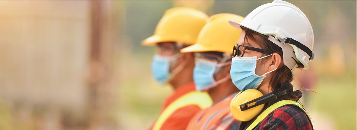 a landscape picure of a worker wearing a PPE